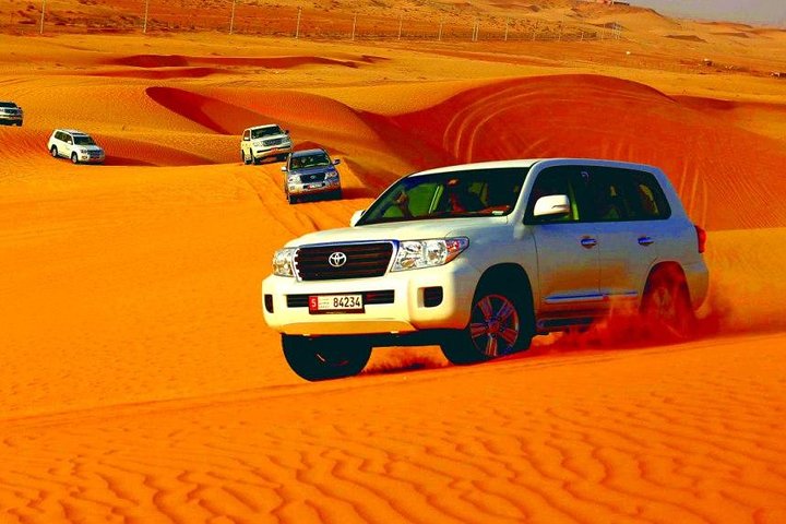 Morning Abu Dhabi Desert Dune Bashing and Camel Ride